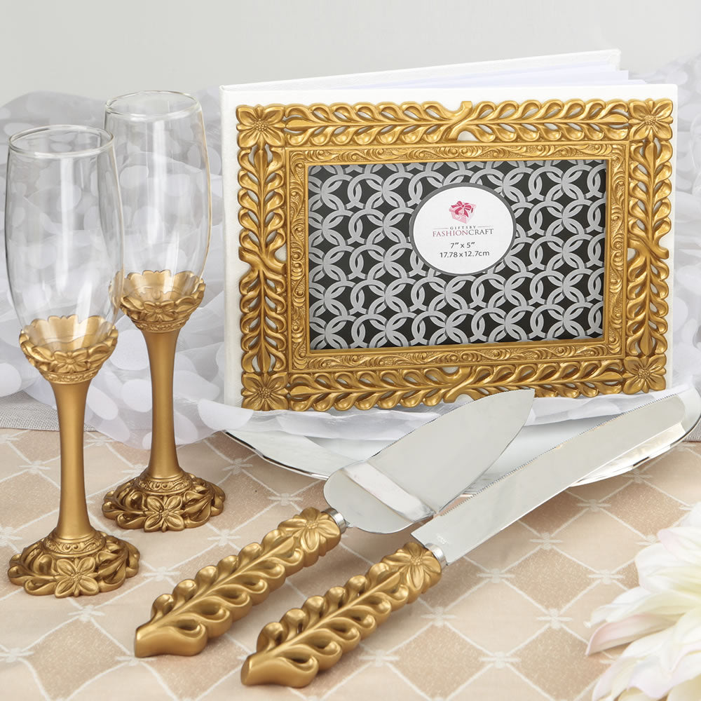 Gold lattice botanical collection set consisting of a cake knife set a flute set and a guest book